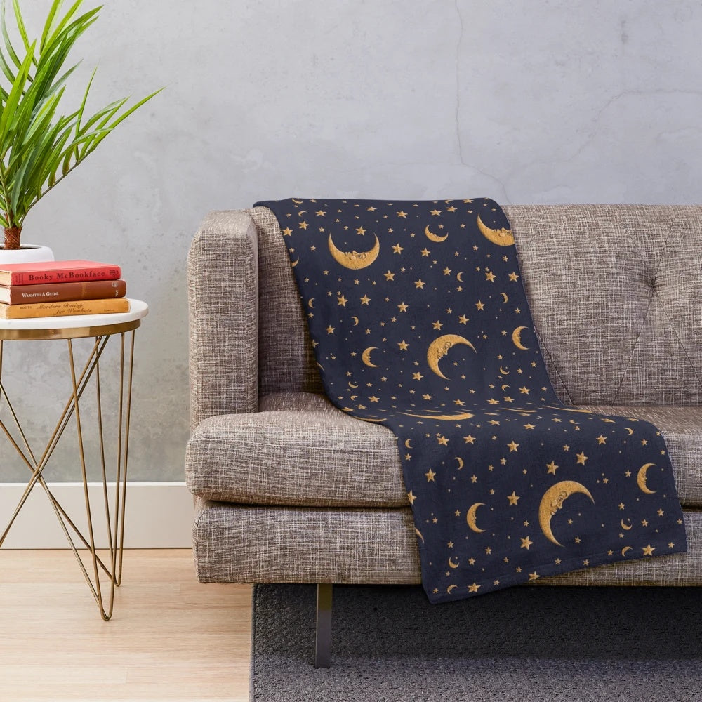 Vintage-style plush blanket with moon and stars design