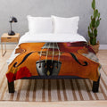 A soft, plush blanket featuring a viola, perfect for music enthusiasts.