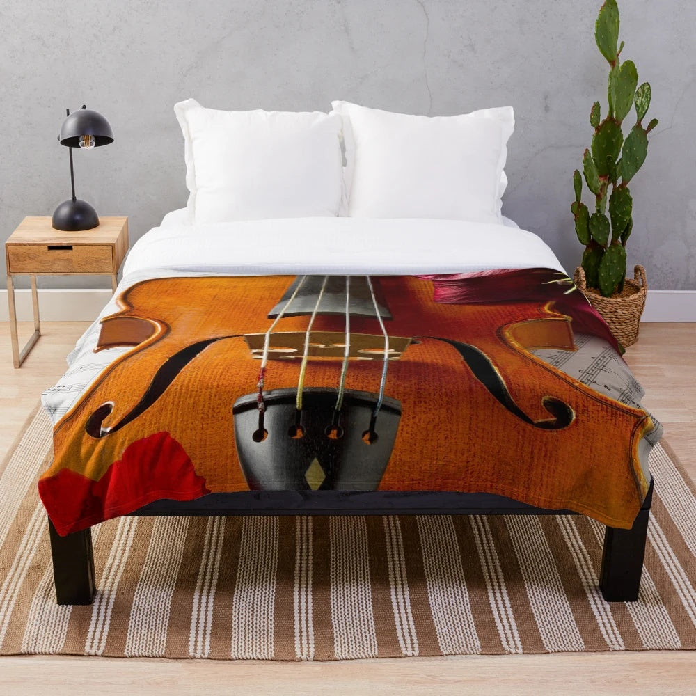 A soft, plush blanket featuring a viola, perfect for music enthusiasts.