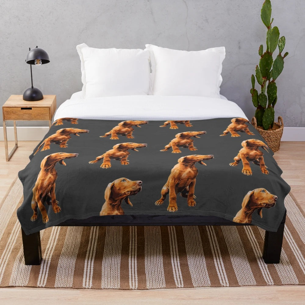 Vizsla puppy face on a plush, soft blanket