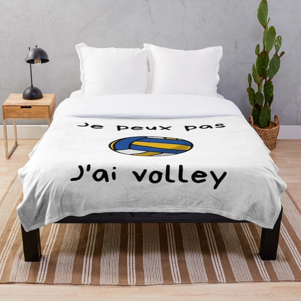 Soft and cozy plush blanket with a volleyball design