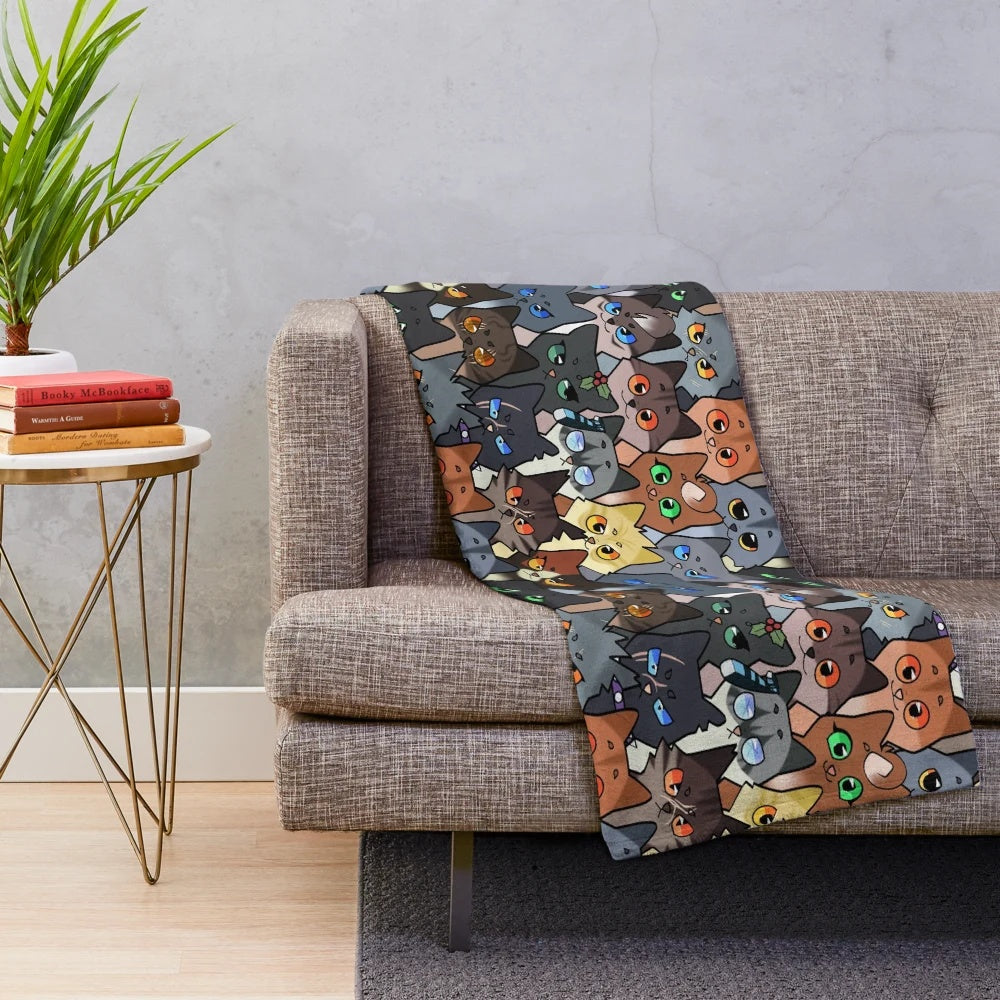Soft and cuddly plush blanket featuring a repeating pattern of warrior cat characters