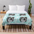 Watercolor illustration of an American Staffy dog wearing glasses on a plush blanket