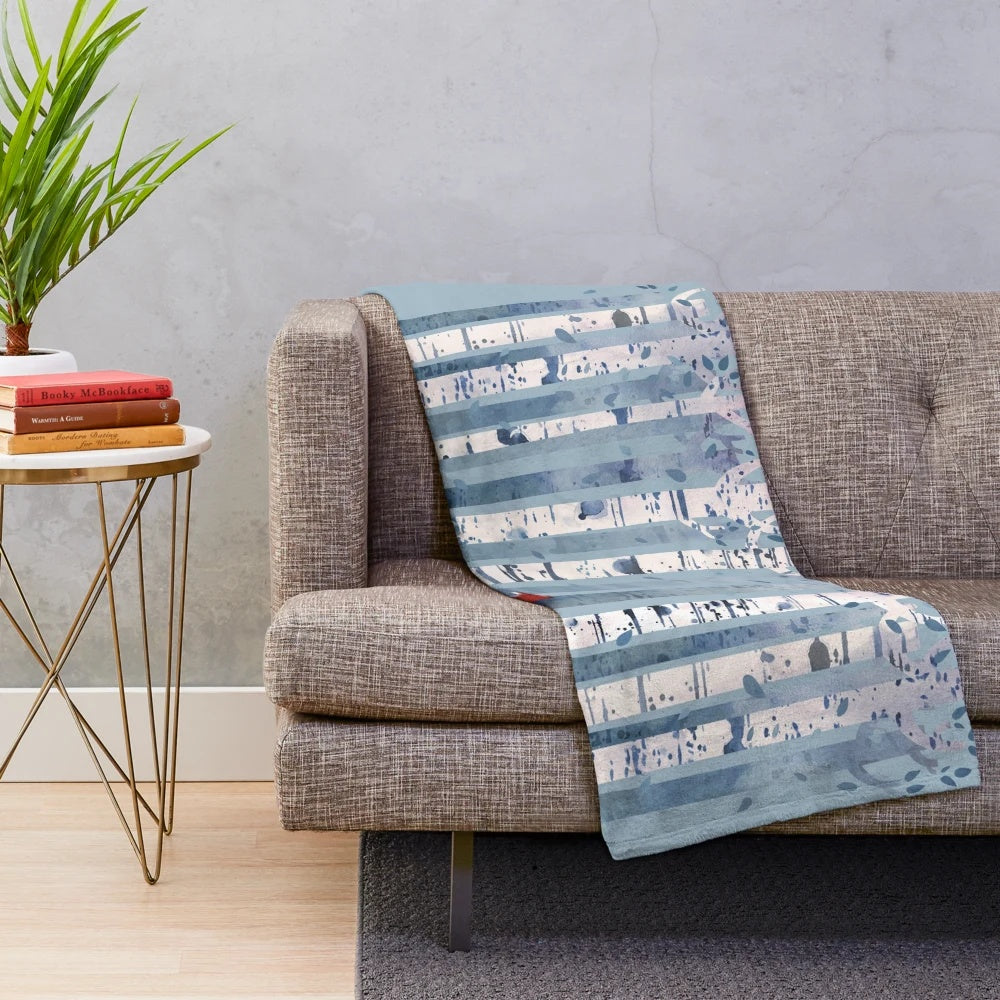 Soft and soothing blue plush blanket featuring a watercolor birch forest scene