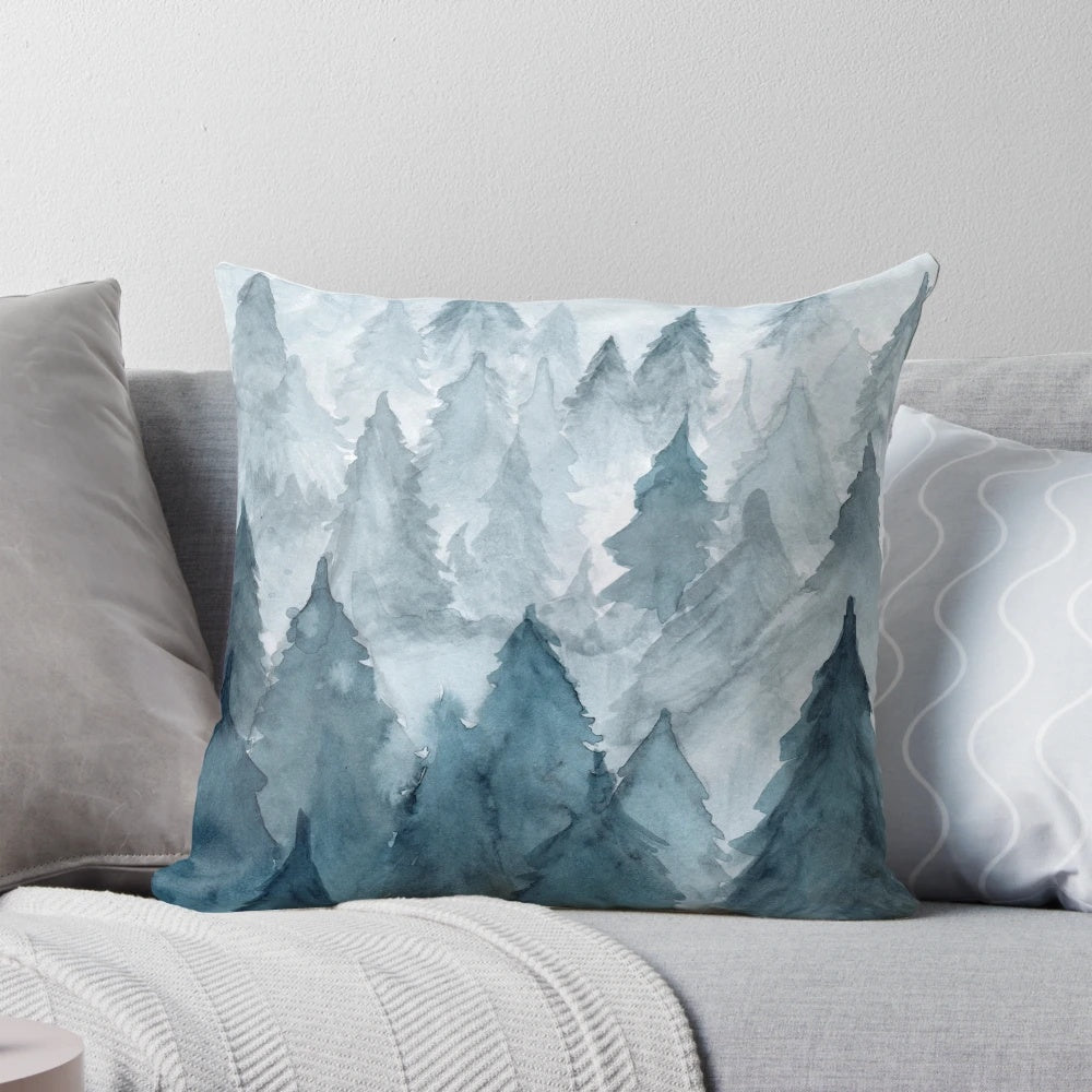 Watercolor painting of a snowy forest landscape on a decorative pillow