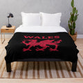 Soft and cozy plush blanket featuring a majestic Welsh red dragon design