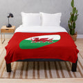 Plush blanket featuring the Welsh rugby team's iconic red dragon symbol