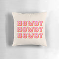 Soft, pink pillow with "Howdy" text, perfect for adding a touch of Texas charm to any room.