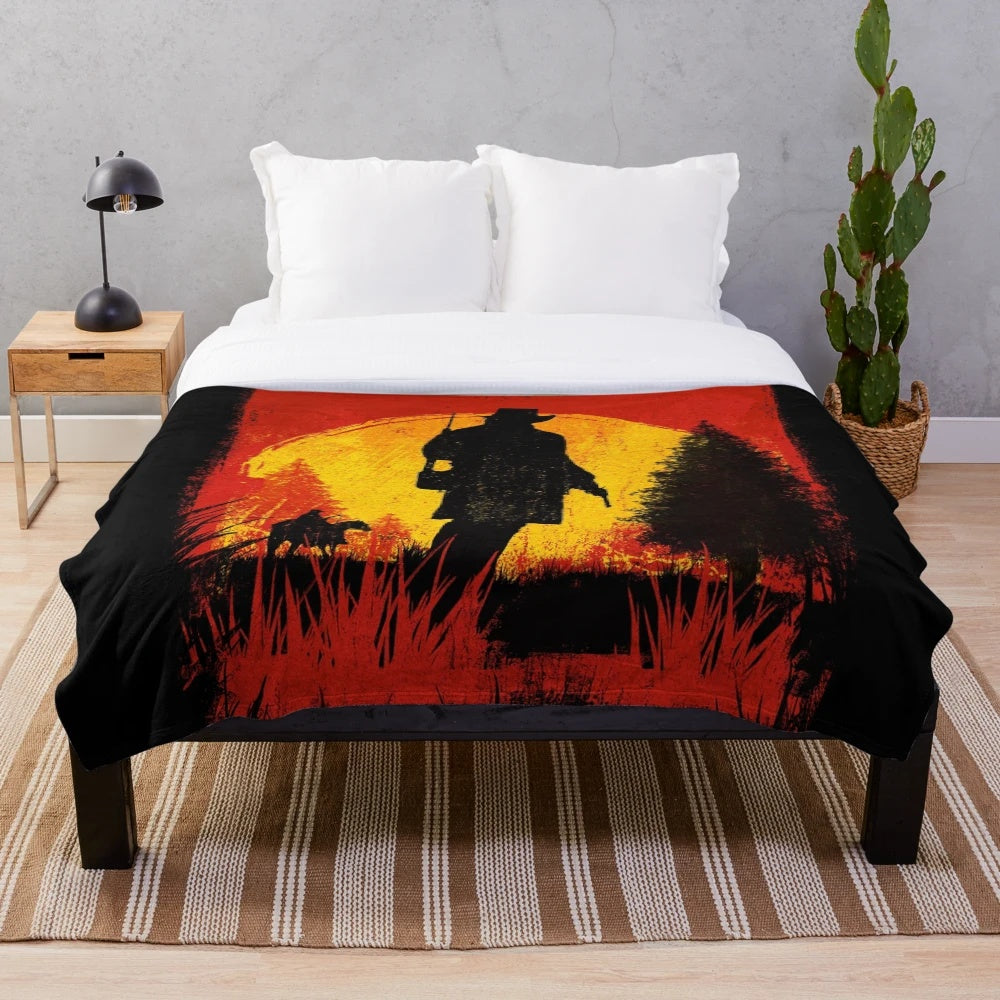 Red Dead Redemption-themed plush blanket with cowboy and sunset design