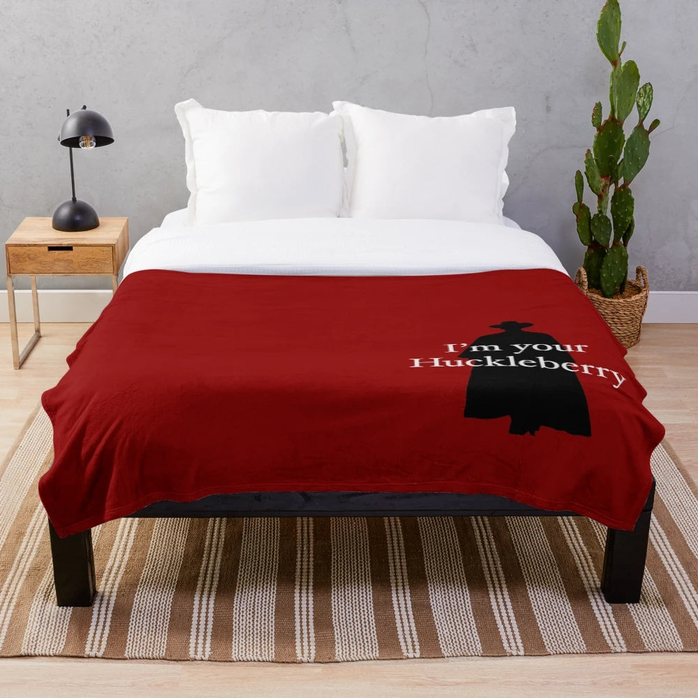Western-themed plush blanket with huckleberry design