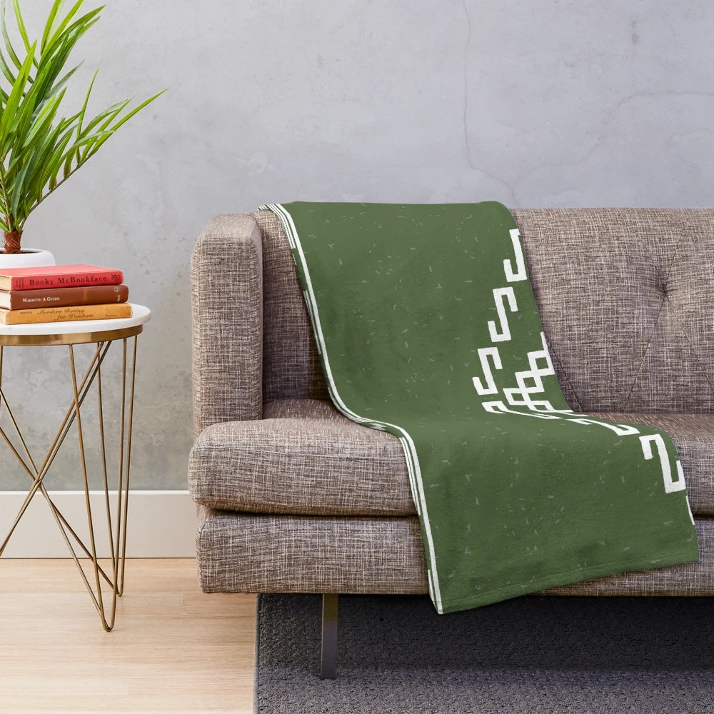 Poncho plush blanket with spaghetti western-inspired pattern