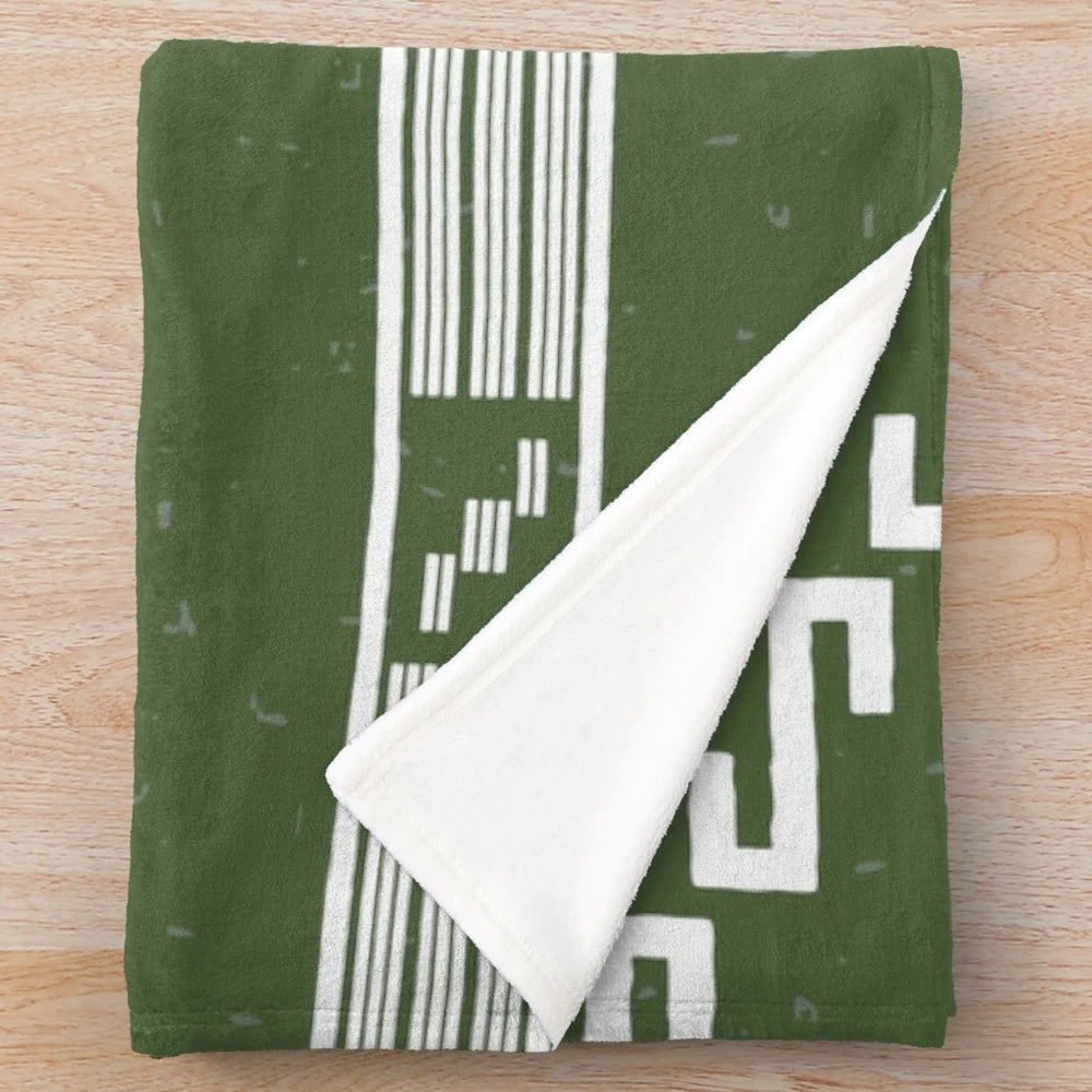 Poncho plush blanket with spaghetti western-inspired pattern
