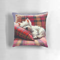 Adorable west highland terrier dog sleeping peacefully on a tartan patterned pillow
