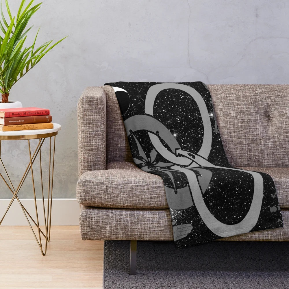 Wheel of Time-themed black and white plush blanket featuring telaranrhiod and other iconic symbols