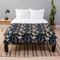 Whippet plush blanket with a soft, cozy animal print design