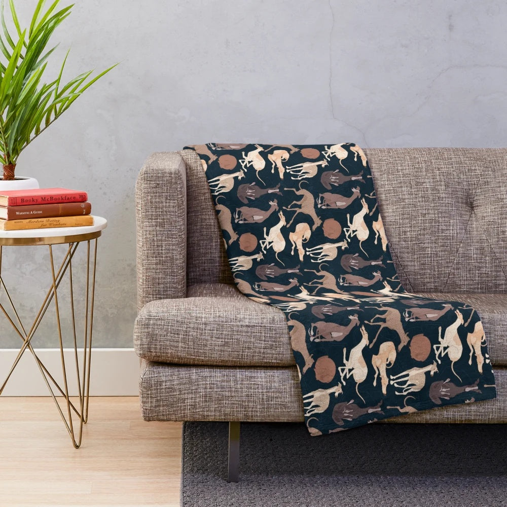 Whippet plush blanket with a soft, cozy animal print design