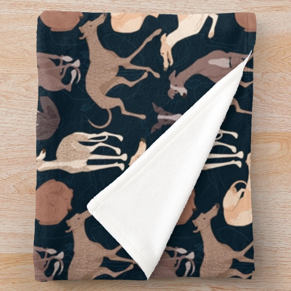 Whippet plush blanket with a soft, cozy animal print design