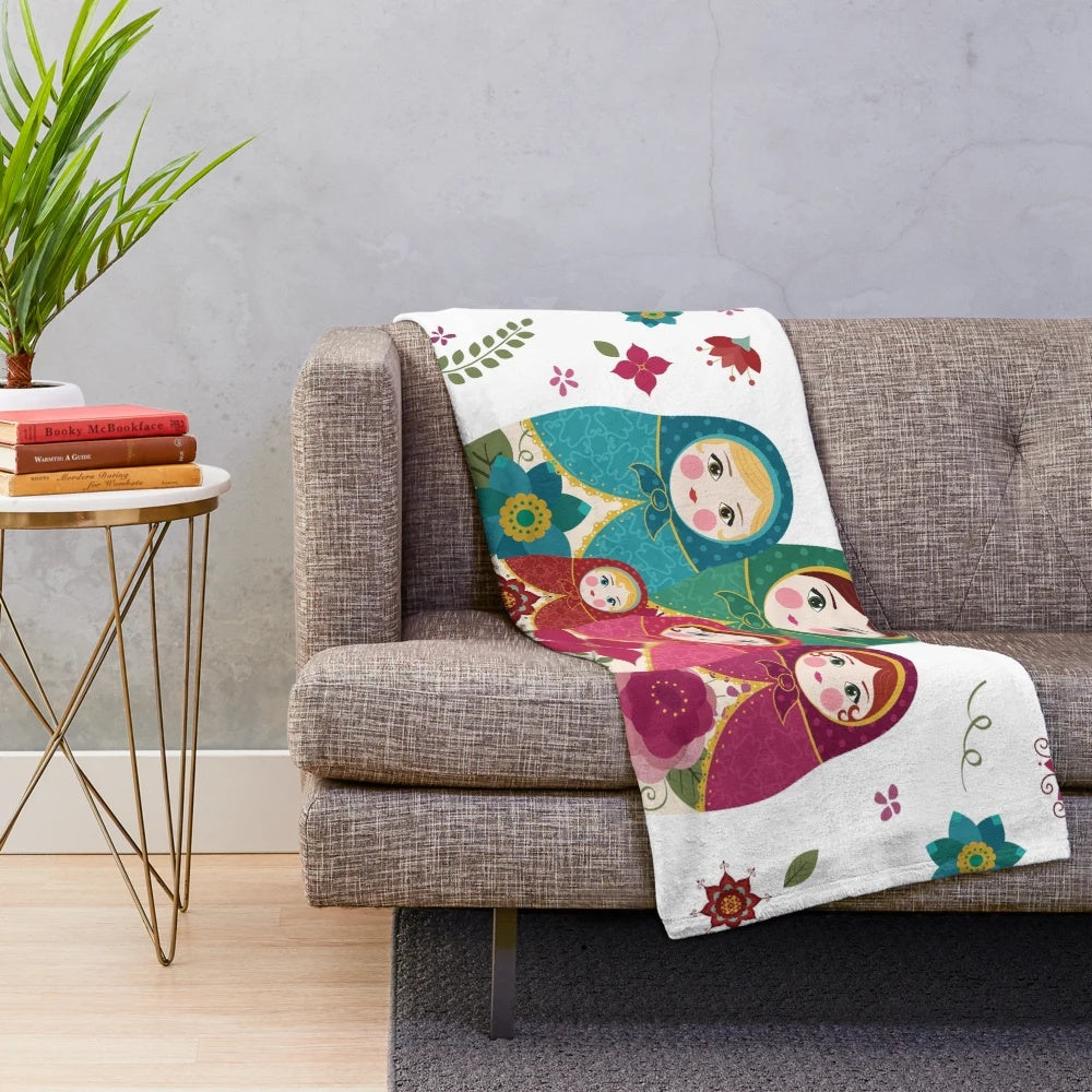 White plush blanket with Russian nesting dolls or matryoshka pattern