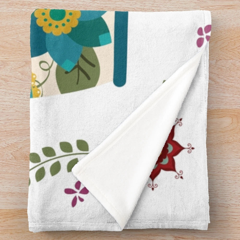 White plush blanket with Russian nesting dolls or matryoshka pattern