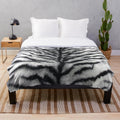 White tiger print plush blanket with graphic animal skin pattern