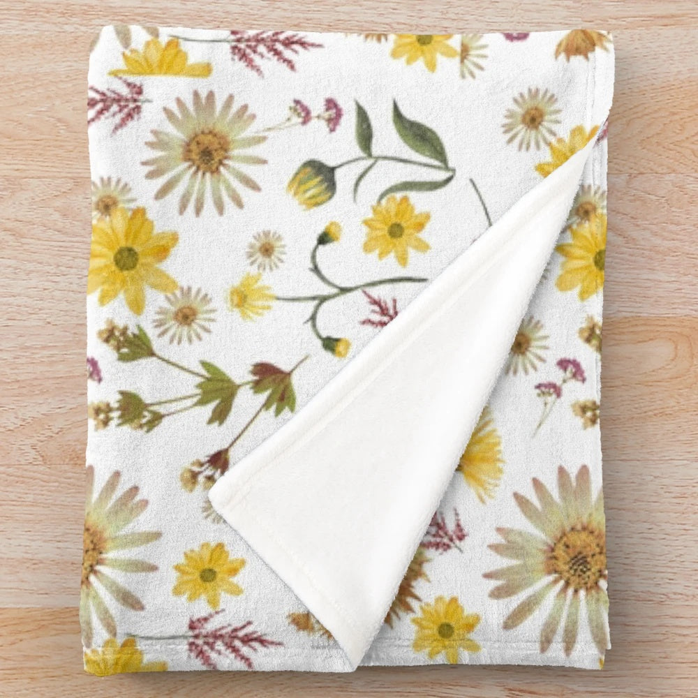 Closeup of a plush blanket with a wild flowers pattern