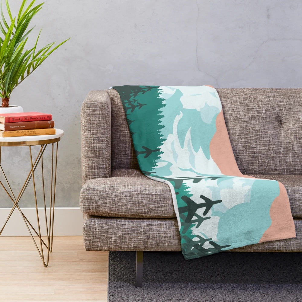 Plush blanket featuring a winter landscape with a bus in the woods