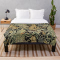 Plush blanket featuring a William Morris inspired forest and floral pattern