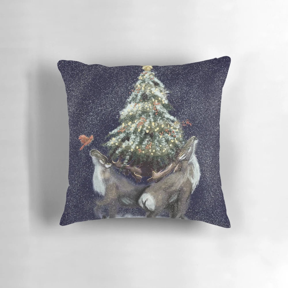 A soft, plush pillow featuring a winter caribou design, perfect for adding cozy holiday cheer to your home.