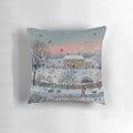 Cozy winter landscape pillow featuring a snowy cottage scene with birds and a dog walker at sunset