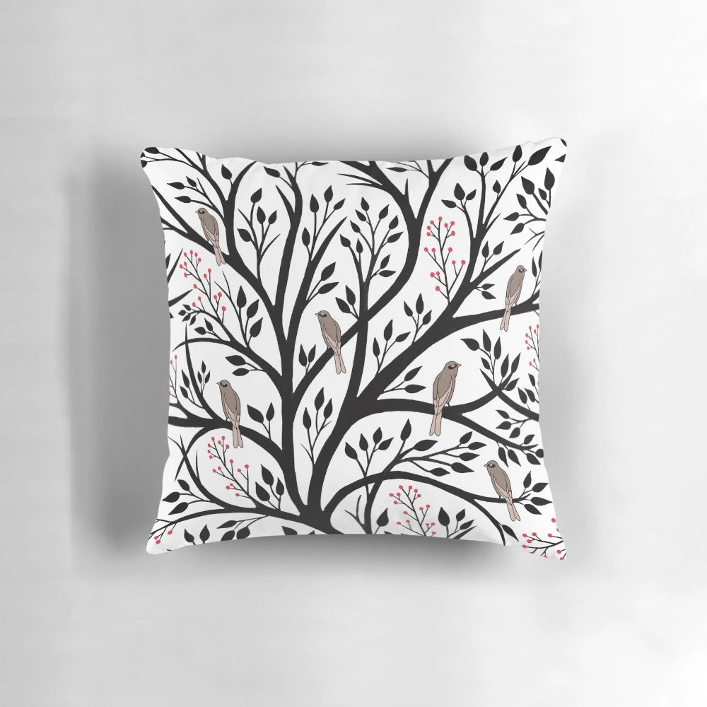 Decorative throw pillow featuring a tranquil winter forest scene with birds and berries in black, red, and white.