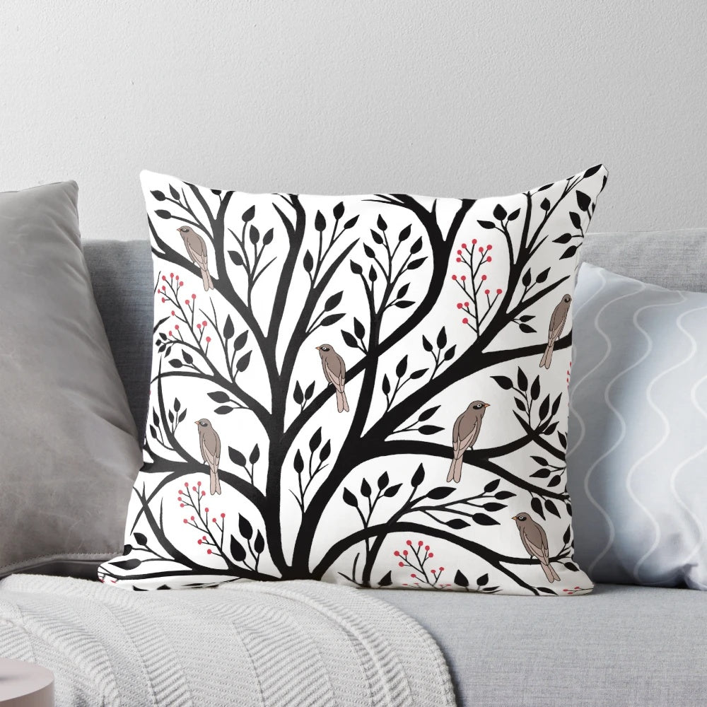Decorative throw pillow featuring a tranquil winter forest scene with birds and berries in black, red, and white.