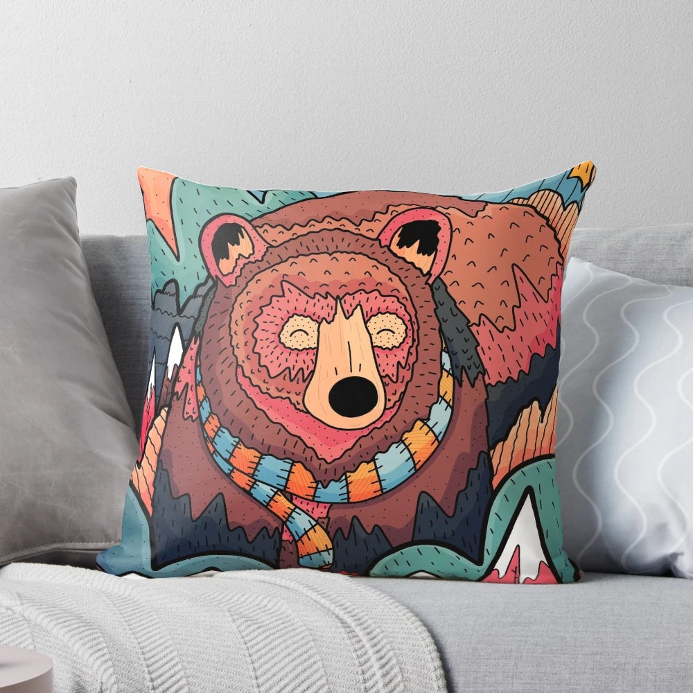 Decorative forest-themed pillow with a whimsical bear character against a colorful woodland background