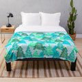 Wintergreen Christmas trees plush blanket with snowy, forest-inspired design