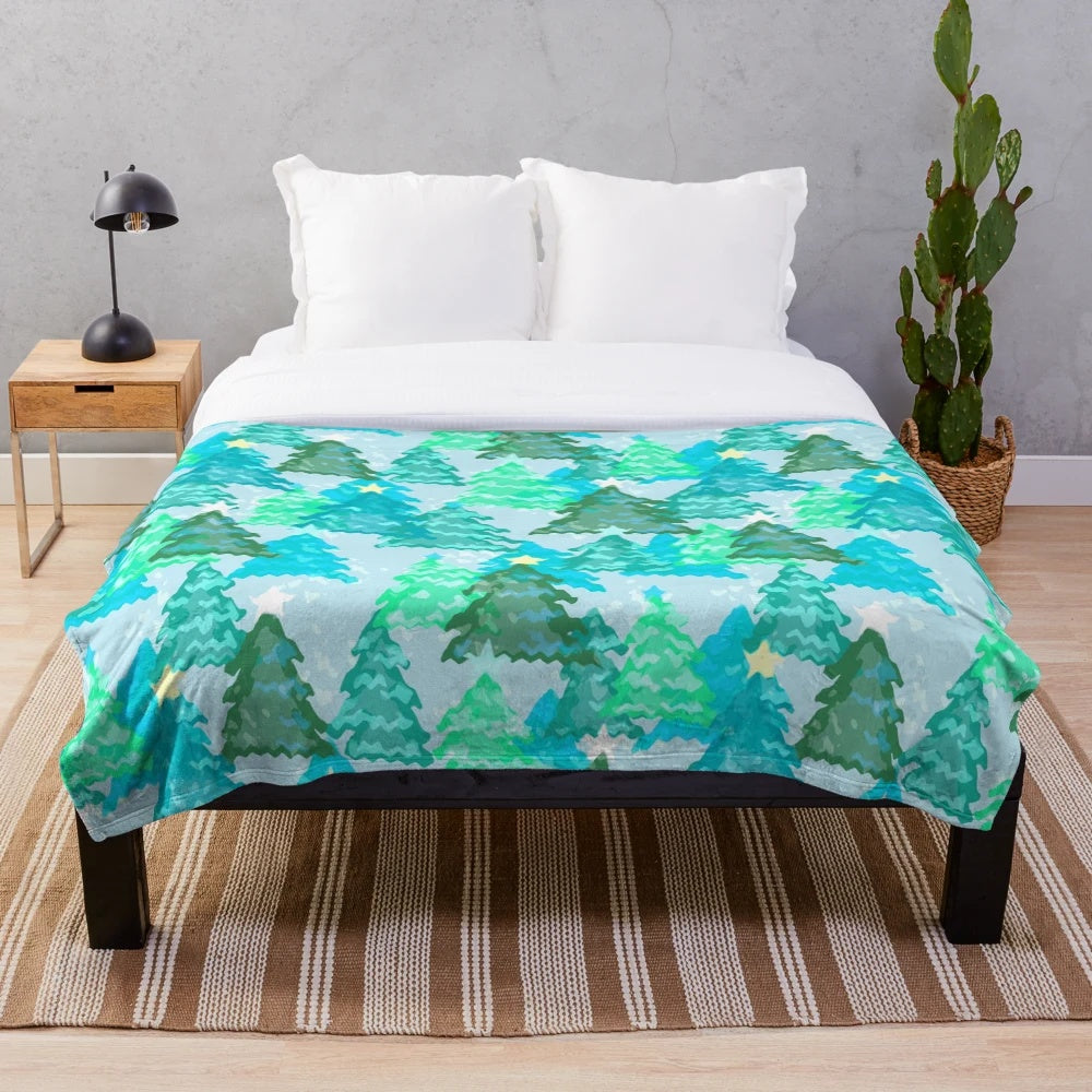 Wintergreen Christmas trees plush blanket with snowy, forest-inspired design