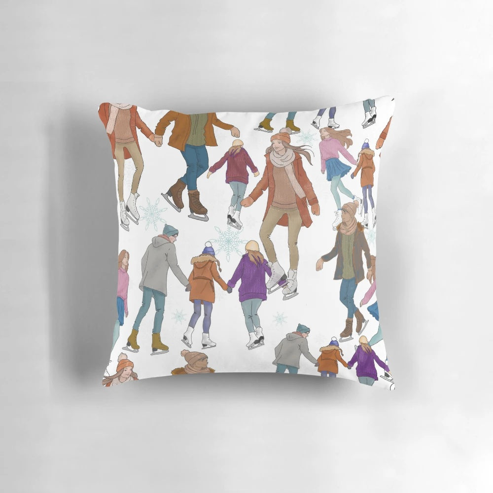 A cozy decorative pillow featuring a picturesque winter ice skating scene with people ice skating in the snow.