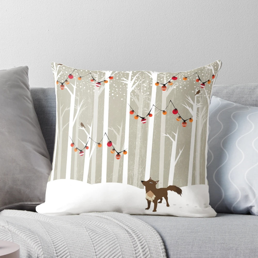 A cozy winter landscape pillow featuring a snowy forest scene with a majestic wolf and festive Christmas tree.