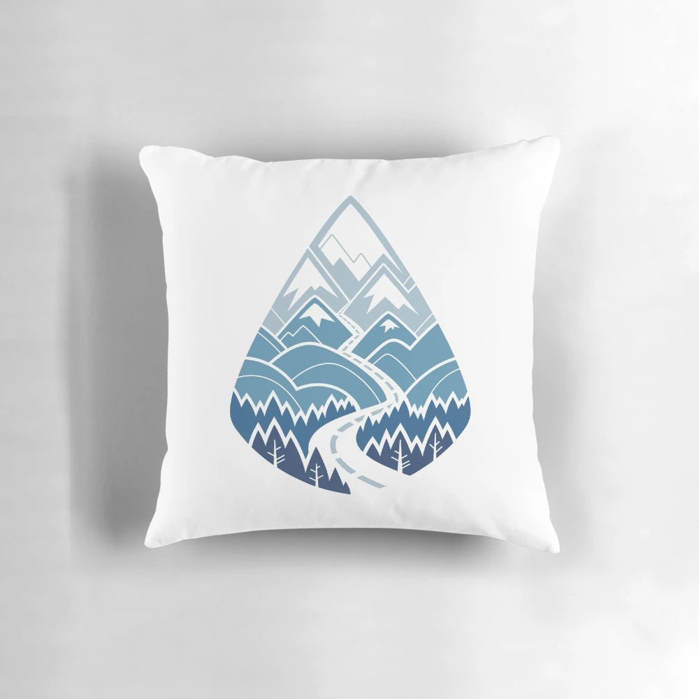 A white pillow featuring a scenic road winding through mountains and forests, perfect for nature and travel enthusiasts.