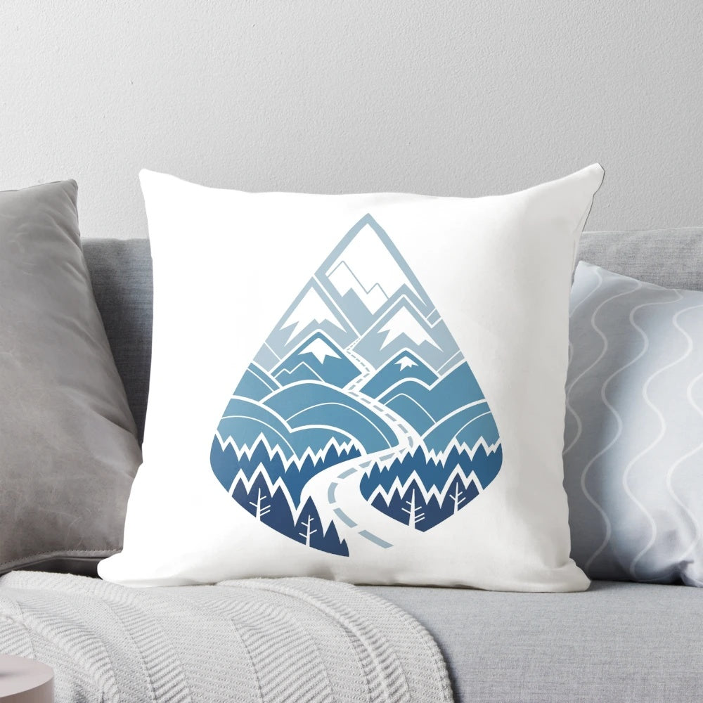 A white pillow featuring a scenic road winding through mountains and forests, perfect for nature and travel enthusiasts.