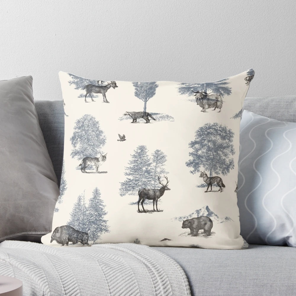 Decorative winter pillow featuring an illustration of woodland animals like foxes, bears, and birds in a snowy forest scene.