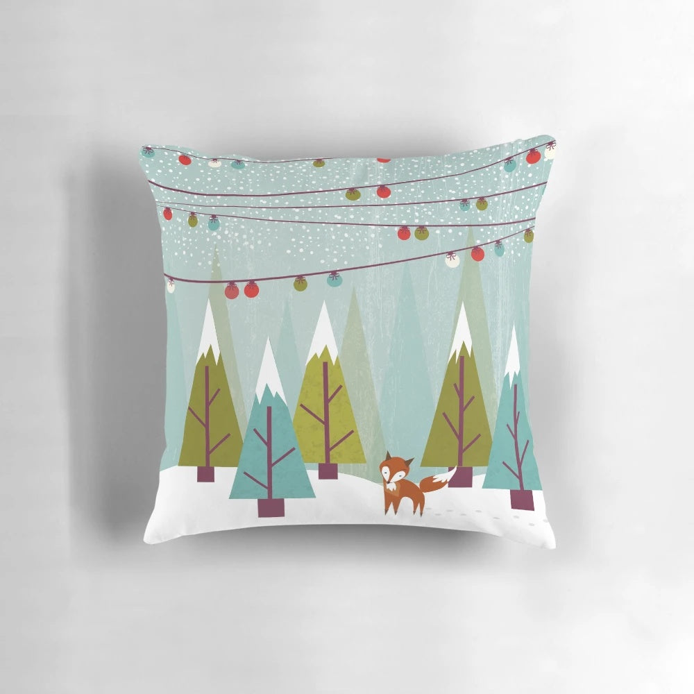 Plush winter pillow featuring a snowy forest scene with a cute fox and holiday-inspired colors