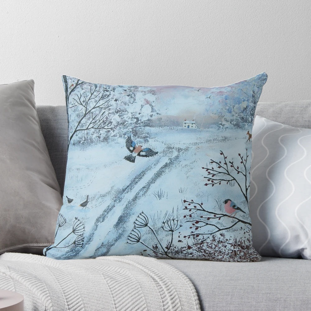 A soft, plush pillow featuring a peaceful winter landscape with birds and snow-covered trees.