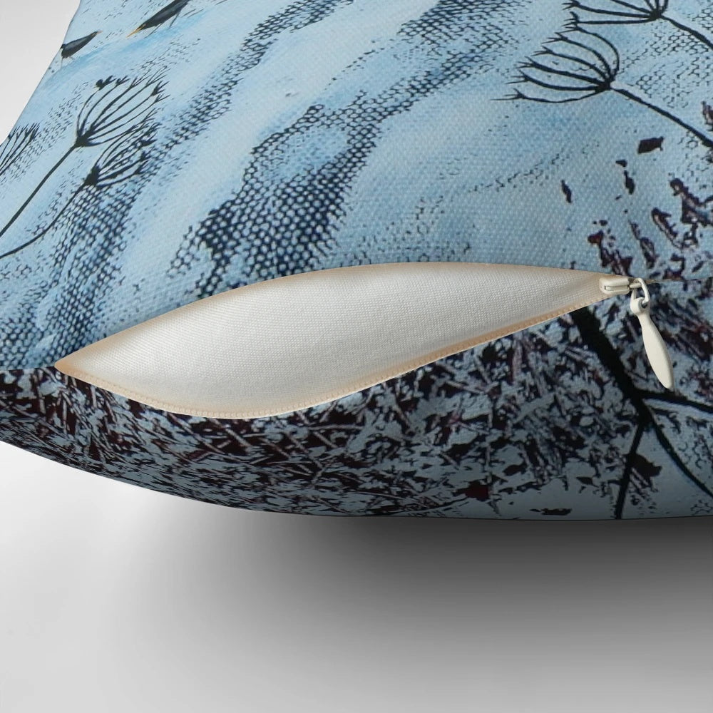 A soft, plush pillow featuring a peaceful winter landscape with birds and snow-covered trees.
