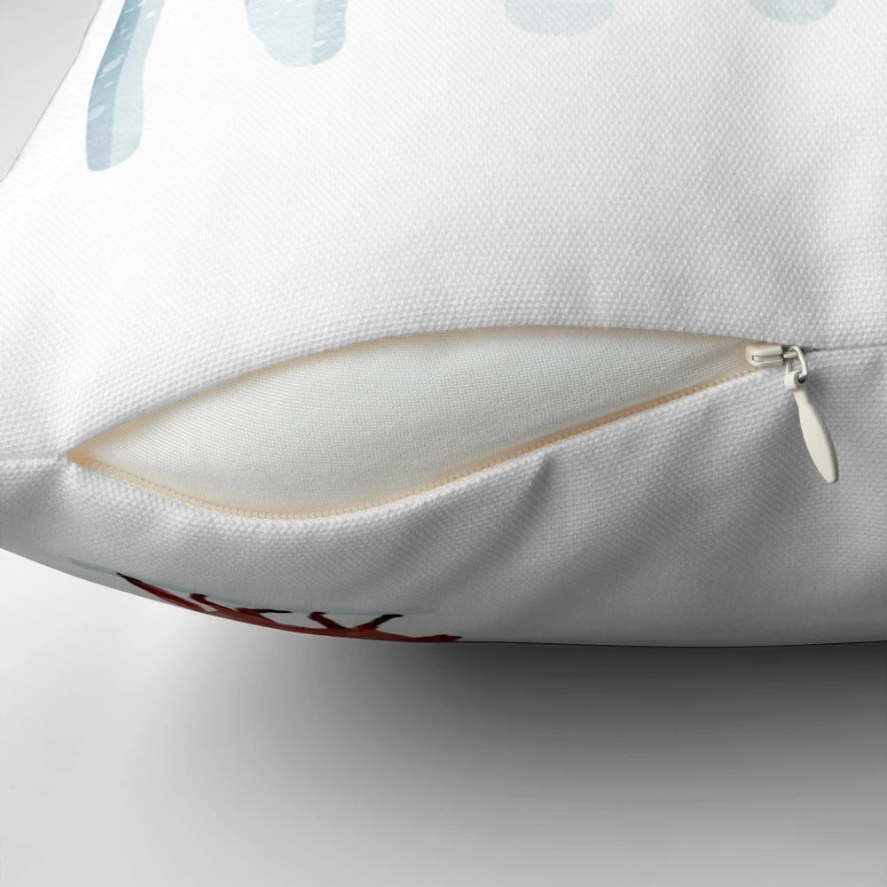 A plush, decorative pillow featuring a winter forest scene with a fox, branches, and snow.