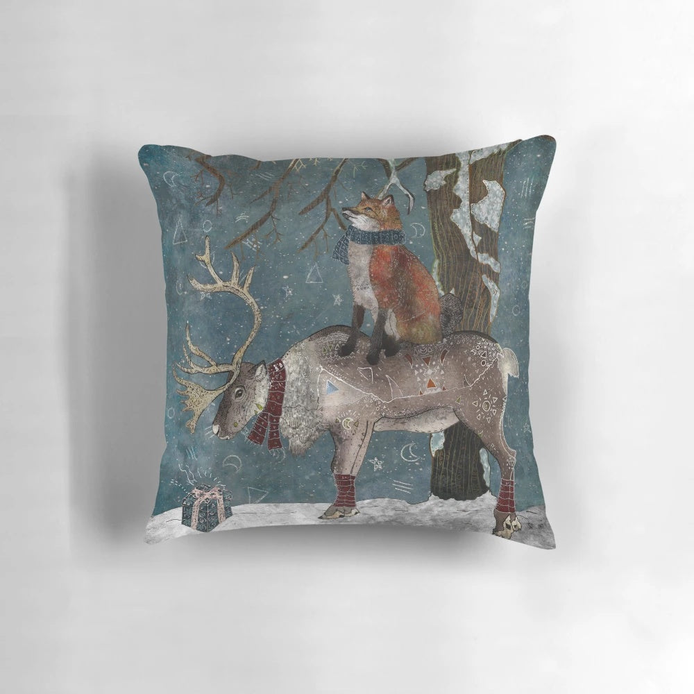 Soft, plush pillow featuring a snowy winter forest landscape with foxes