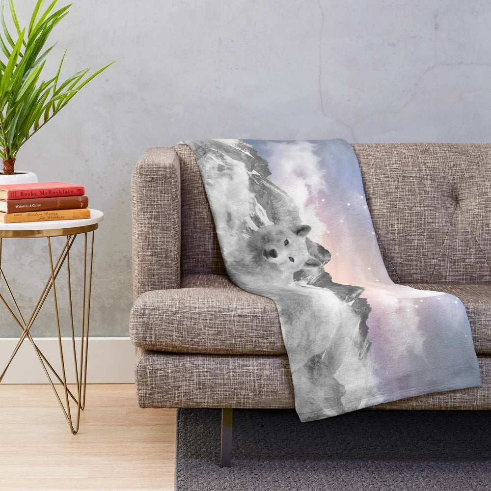 Plush blanket featuring a winter wolf design with a teal galaxy night sky