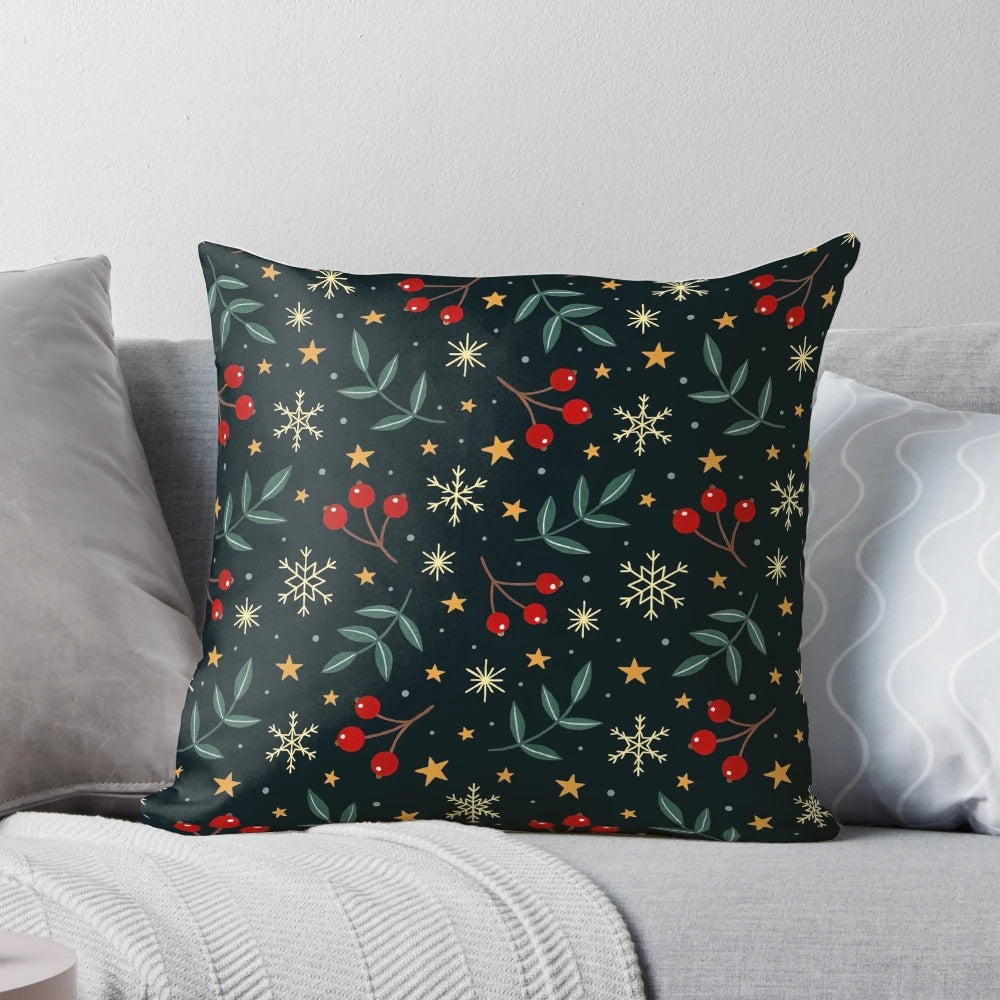 A plush, soft throw pillow with a winter nature design featuring berries, leaves, and snowflakes against a dark background.