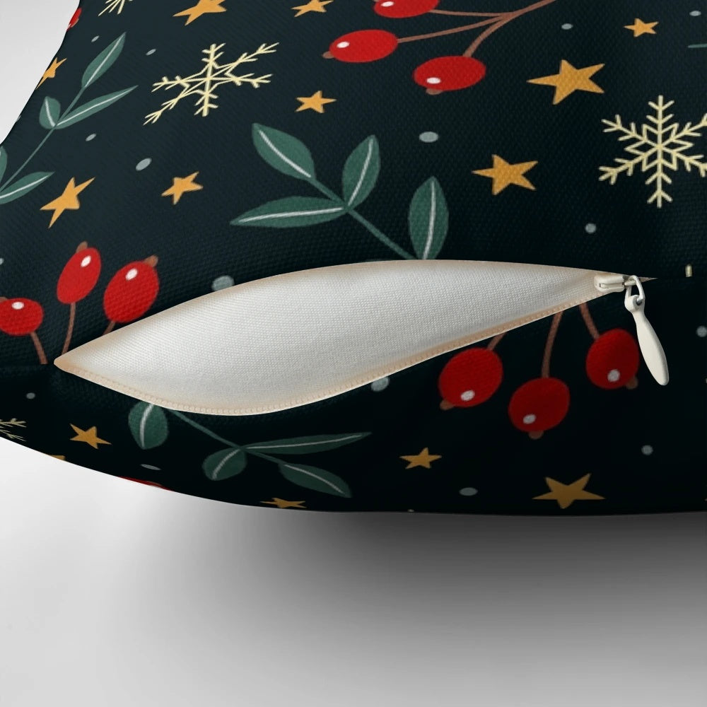 A plush, soft throw pillow with a winter nature design featuring berries, leaves, and snowflakes against a dark background.