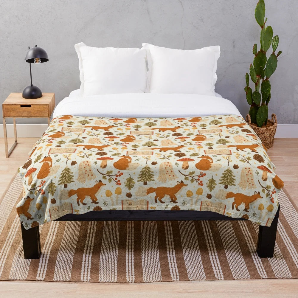 Cozy winter woodland plush blanket with forest animal and botanical design