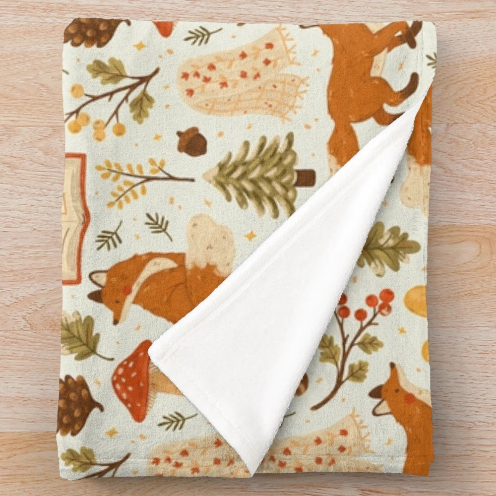 Cozy winter woodland plush blanket with forest animal and botanical design