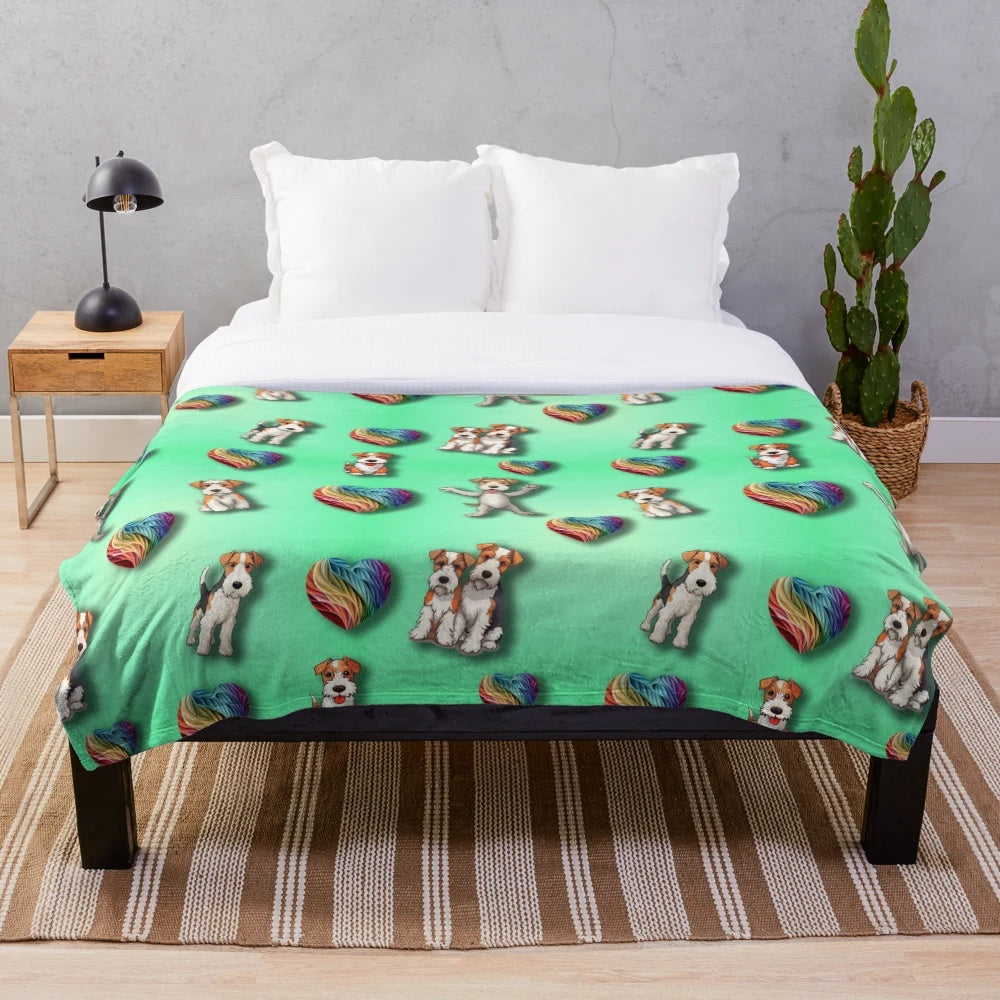 Wire Haired Fox Terrier on a plush rainbow heart-patterned blanket